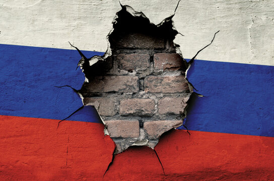 flag of Russia is painted on an old wall with cracks