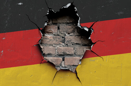 national flag of Germany is painted on an old wall with cracks
