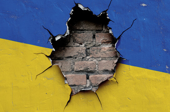 flag of the Ukraine are painted on an old wall with a cracked