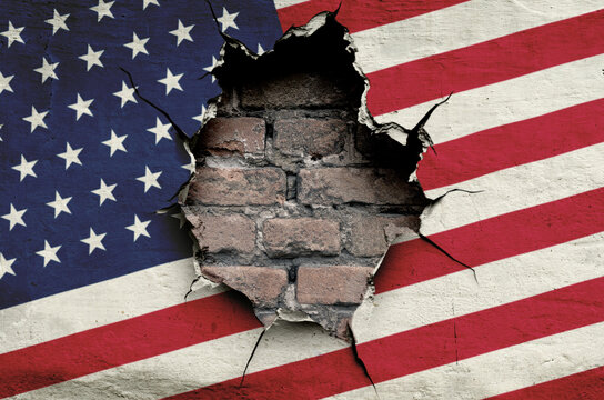 national flag of the United States of America is painted on an old wall with a large hole