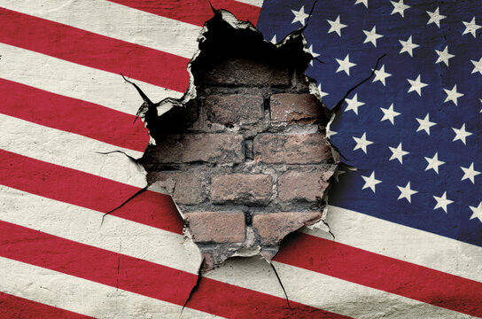 national flag of the United States of America is painted on an old wall with a large hole