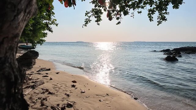 Crashing waves with golden sunlight reflection along Batu Topeng Beach coastline in Karimunjawa Island, Indonesia showcasing tropical ocean beauty and serene nature.