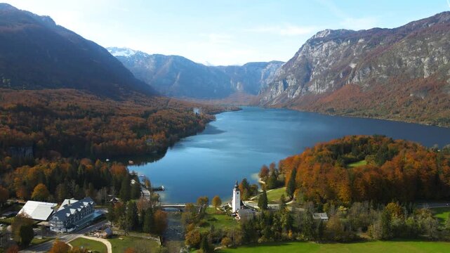 Drone tracking along Lake Bohinj toward St. John the Baptist Church, Slovenia