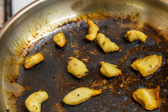 Chicken breast meat in Burnt Frying Pan