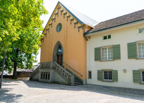 Masonic lodge Modestia cum Libertate, Gothic Revival Building with Stone Stairs on Lindenhof Hill Park in Old Town house wall facade architecture Zurich, Switzerland.