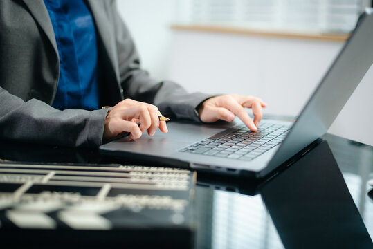 Creative filmmaker planning a video production project with a clapperboard, laptop and smartphone, representing filmmaking, content creation, media and digital storytelling.