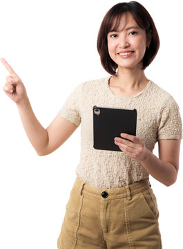 Asian woman pointing while holding tablet with cheerful smile on isolated background for business and education