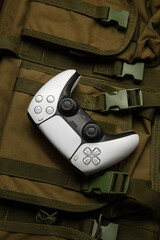 White game controller on military gear © solidmaks
