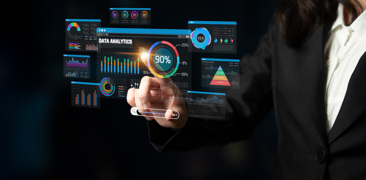 Business professional analyzing data graphs and charts using touch screen technology in modern corporate environment Sigmoid