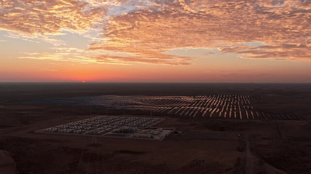 Aerial View of Utility-Scale Solar Farm with Battery Energy Storage System in Arid Desert