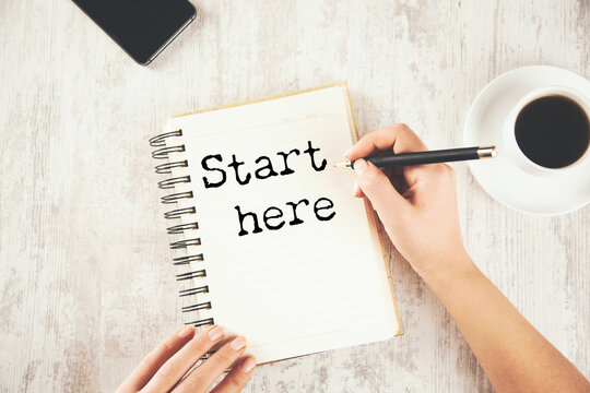Notebook with first page reading start here written in casual handwriting