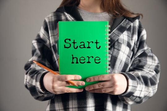Notebook with first page reading start here written in casual handwriting