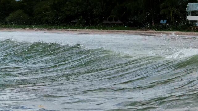 Zoomed in shot of a wave crashing in slow motion on Tamarin beach, Mauritius