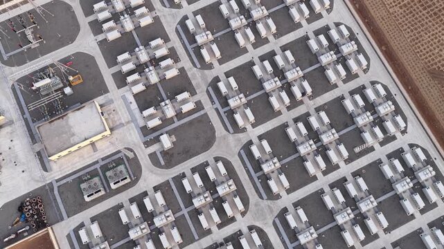 Aerial View of Utility-Scale Solar Farm with Battery Energy Storage System in Arid Desert