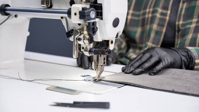A close-up of a sewing machine at work. 