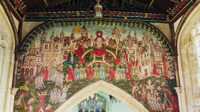 Detailed view of the medieval Doom Painting depicting the Last Judgement above the chancel arch inside St Thomas Church in Salisbury