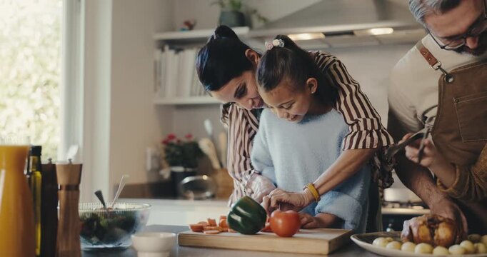 Cooking, help and family in kitchen at house for bonding, care and learning culinary skill for growth. Smile, connection and child with parents for preparing dinner, meal or supper for development.