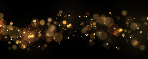 Soft golden bokeh light spots scattered on a deep black background with glowing warm highlights on transparent background © svetilo