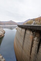 Vidraru Dam stands as a stark reminder of the ongoing energy crisis, showcasing low water levels and exposed banks due to a harsh drought © Damian