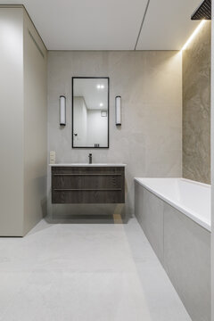 Modern Bathroom Interior with Vanity, Mirror, and Bathtub