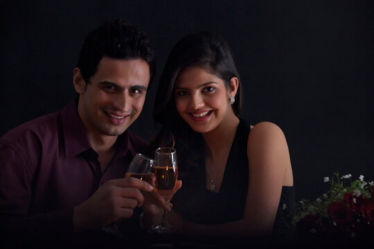 Portrait of a couple with glasses of wine