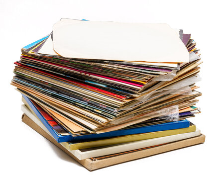 Stack of vintage vinyl records isolated on white background. Collection of old music LPs. Pile of vintage music media.