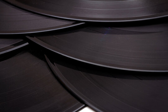 Group of black vintage records. Vinyl records texture, music background. View of phonograph records.