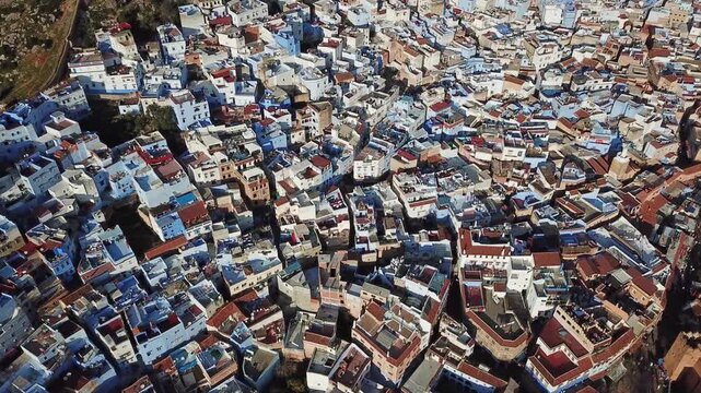 Aerial view of the historic blue-washed buildings and narrow streets of the medina in Chefchaouen, Tangier-Tetouan-Al Ho, Morocco.