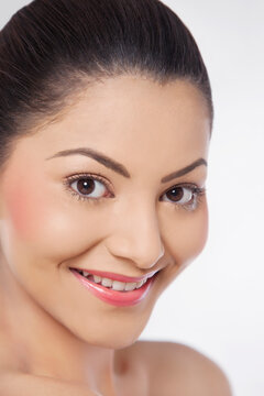 Close-up of an attractive young woman over white background 