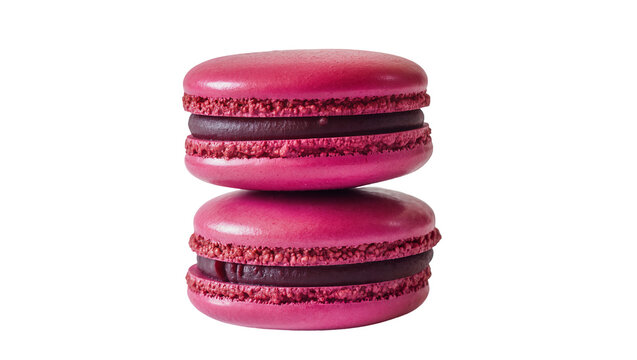 Two pink raspberry macarons stacked filled with dark chocolate ganache, isolated on transparent background