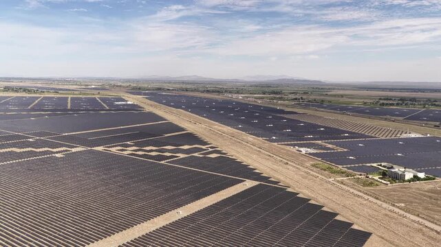 Aerial View of Utility-Scale Solar Farm with Battery Energy Storage System in Arid Desert