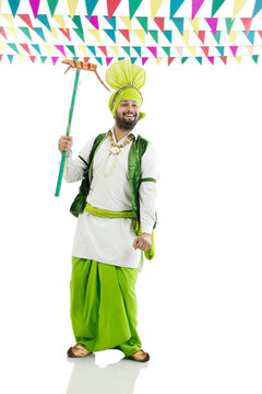 Sikh man holding a Katow 