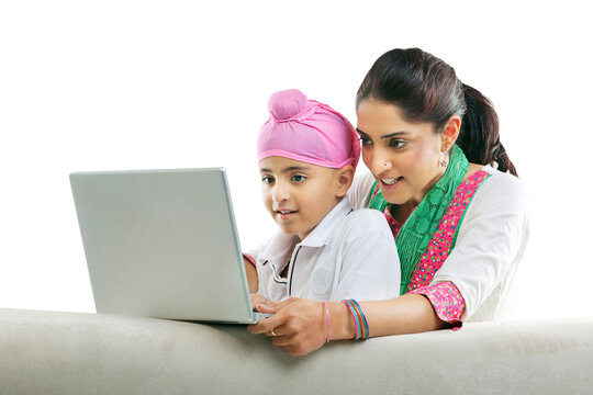 Mother with her son looking at a laptop 
