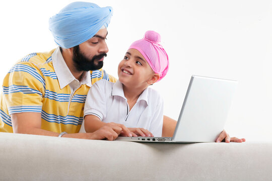 Father and son with a laptop 