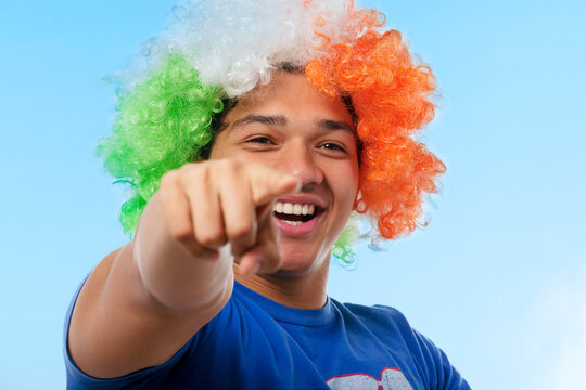Portrait of a young man cheering 