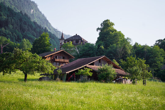 Scenic Mountain Countryside With Traditional Wooden Houses and Green Landscape