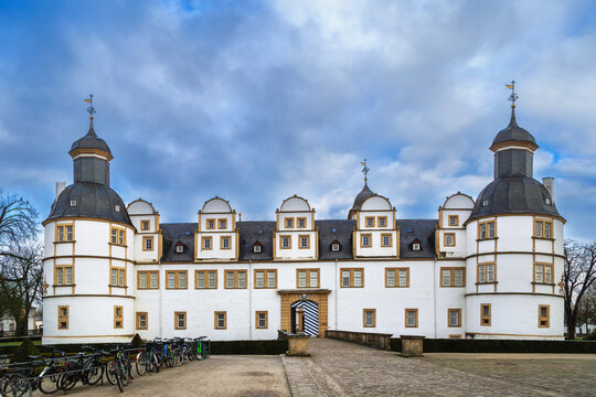 Neuhaus Castle in Paderborn, Germany, front view. Historic baroque palace architecture under cloudy winter sky without snow