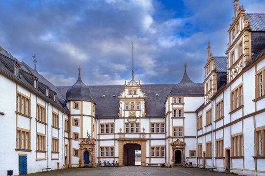 Courtyard of Neuhaus Castle in Paderborn, Germany, inner view. Historic renaissance palace architecture under cloudy winter sky