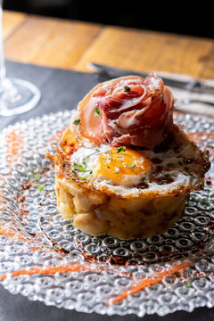 Spanish Potato Dish with Fried Egg and Cured Ham