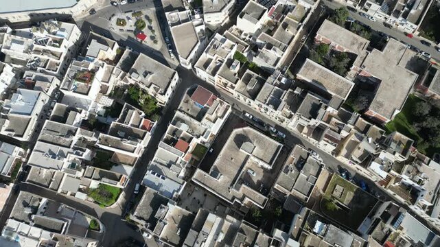 Aerial view of the dense historic urban fabric, rooftops, and narrow streets of the coastal town of Otranto, Apulia, Italy.