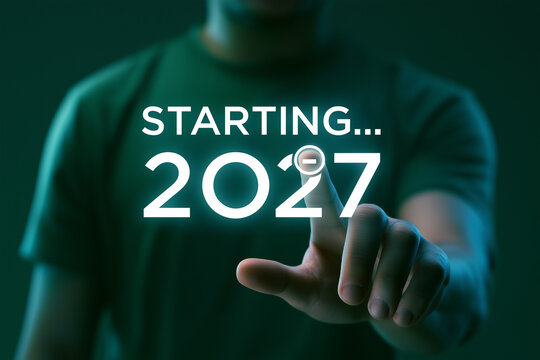Business professional touching digital 2027 new year countdown hologram for startup launch
