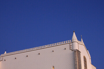 Saint Francis Church Roofline at Blue Hour Dusk in Evora Portugal, Manueline Gothic Architecture with Copy Space © monkeybusiness.pt