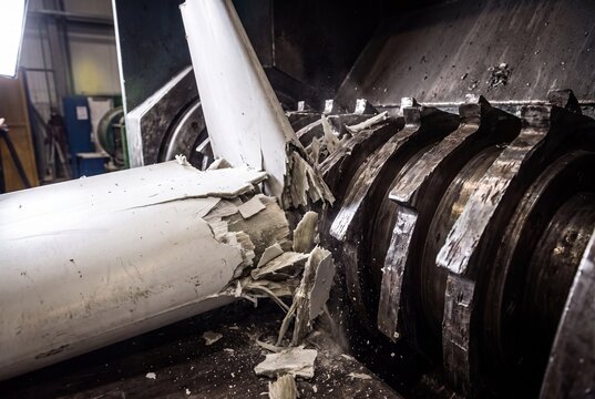 Industrial shredder machine crushing insulation material in recycling plant