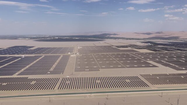 Aerial View of Utility-Scale Solar Farm with Battery Energy Storage System in Arid Desert