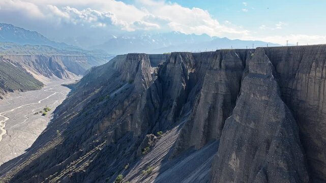 Aerial view of eroded soil cliffs and deep geological fissures in Anjihai Grand Canyon, Xinjiang, China.