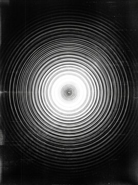 Abstract concentric circular ripple pattern in black and white creates hypnotic focal point for optical illusion and digital art projects.