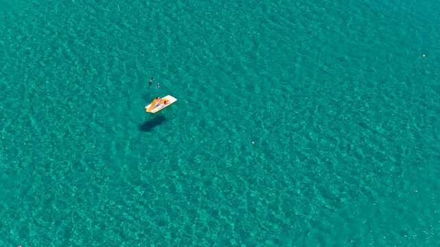 Orange and white watercraft floating