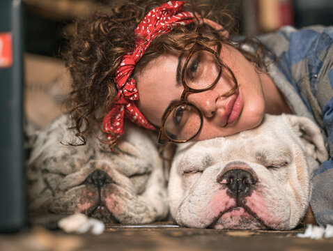 Diverse Woman Working On Laptop In Modern Office With Dog Sleeping Authentic Pet Friendly Workplace Corporate Wellness Realism Companionship