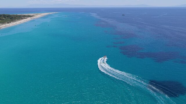Speedboat carving a sweeping turn