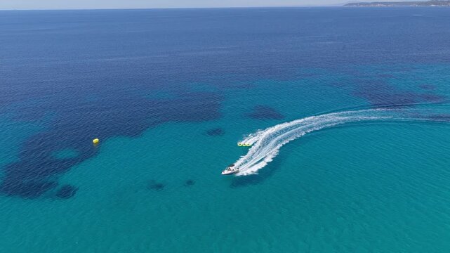 Speedboat carving a sweeping wake